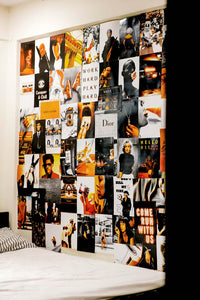 Boujee orange & black posters collage on a wall next to a bed