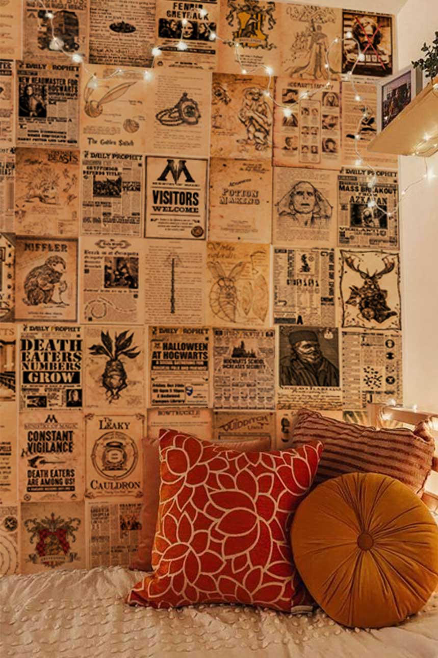 Harry Potter newspaper collage on a wall behind a white bed with throw pillows & string lights