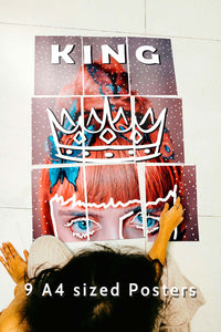 girl sitting with block kit 9 set posters on the floor